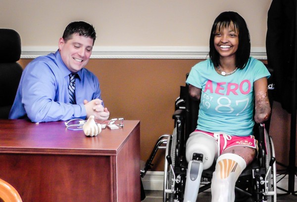 Chris Berger helps patient Shannon Smith